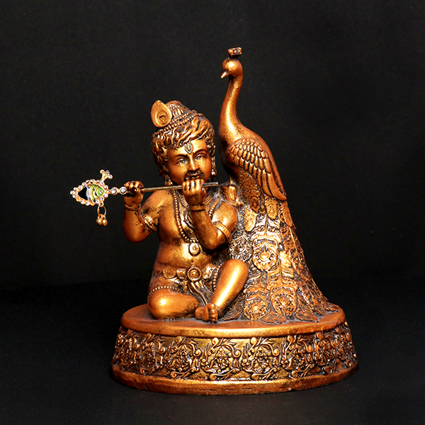 Bal Krishna with Peacock Idol Showpiece for Home Decor (Golden) Polyresin – 7 Inch