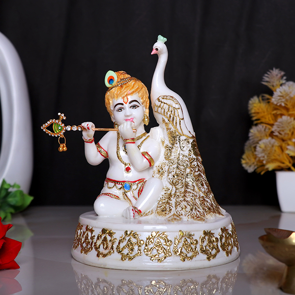 Bal Krishna Statue Sits Beside a Peacock Idol Showpiece for Home Decor (Golden Foil) Marble – 7 Inch